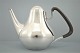 Georg Jensen, Henning Koppel; A pitcher of sterling silver and ebony #1017