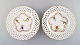 Two antique 
Meissen plates 
in pierced 
porcelain with 
...