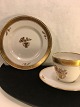 Guldkurv.
kaffekop med 
underkop 
Royal 
Copenhagen RC. 
nr. 595 - 9069
Sidetallerken 
RC nr. 595 ...