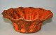 H. A Kähler 
bowl, uranium 
orange glaze, 
1930s, Næstved, 
Denmark. Wavy 
edge. Stamped. 
H: 8.5 cm. ...