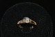 14 karat 
Guldring med 
Brillant 
Ring størrelse 
52