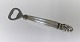 Georg Jensen. 
Silver cutlery. 
Akorn. Sterling 
(925). Bottle 
Opener. Length 
16 cm.