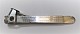 Cigar cutter 
with silver 
(830). Length 
13 cm