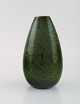 Carl-Harry Stålhane for Rörstrand. Vase with glazed stoneware. Beautiful glaze 
in bright green shades. 1960