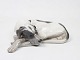 Kgl. 
porcelænsfigur, 
liggende hund, 
nr.: 1634.
Mål: 5 x 20 
cm.
