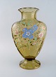 Emile Gallé, France. Large antique vase in smoke colored art glass with flowers, 
branches and cross in enamel. Museum Quality. 1890