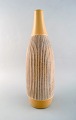 Scandinavian 
ceramist. Large 
vase in glazed 
ceramic with 
grooved body. 
Late 20th ...