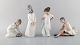 Lladro, Nao og 
Rex, Spanien. 
Fire 
porcelænsfigurer 
af unge piger. 
1970/80'erne. 
Største måler: 
...