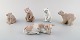 Lladro, 
Spanien. Fem 
porcelænsfigurer.
 Fire bjørne og 
en kalv. 
1980/90'erne.
Isbjørnen 
måler: ...