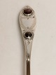 Silver spoon 
with two red 
fluffs dated 
1828