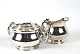 Sugar bowl and 
cream jug in 
925 sterling 
silver by Cohr.
6 x 9 cm and 7 
x 6 cm.