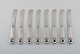 Eight Georg Jensen Acorn butter knives in all sterling silver.
