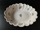 Beautiful, 
European, 
tin-glazed 
faience bowl 
with wavy 
edges, 
white-glazed 
and decorated 
with ...