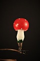 Gammel 
juletræspynt i 
form af svamp 
med rød hat og 
hvide prikker i 
glas.
Højde: 8,5cm.