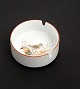 Jagtstellet 
designet af 
Mads Stage for 
Imerco. 
Askebæger med 
Bekkasin. 
Diameter 9 cm. 
Højde 4 ...