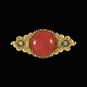 A.N. Dragsted. 
Broche i 14k 
guld med koral 
og diamanter.
To old cut 
Diamanter. 
total ...