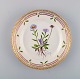 Royal Copenhagen Flora Danica salad plate in hand-painted porcelain with flowers 
and gold decoration. Model number 20/3573.
