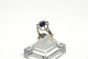 Elegant lady 
ring with dark 
blue stones in 
14 carat gold
Stamped 585
Size 58
The check by 
the ...