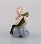 Royal Copenhagen porcelain figurine. Mermaid with fish. 1920s. Model number 
2348.
