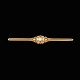 Georg Jensen 
Broche i 14k 
guld med perle 
#287. 
Tegnet af 
Georg Jensen 
1866 - 1935.
Stemplet ...