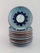 Nittsjö, Sweden. Nine retro plates in glazed stoneware. Beautiful glaze in light 
blue shades. 1960