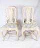 A set of four antique dining room chairs of white painted wood and upholstered 
with light striped fabric from the 1880s.
5000m2 showroom.
