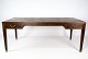 Sofabord i 
palisander 
designet af Ole 
Wanscher fra 
1960erne.  
Bordet er i 
flot brugt 
stand. 
H ...