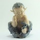 Royal Copenhagen; Figurine of porcelain, a faun with a snake #1712