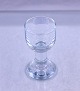 Holmegaard 
Glasværk. Glas 
med rund kumme, 
massiv 
cylindrisk 
stilk, kraftig 
kuplet fod. ...