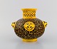 Antique Zsolnay 
vase in 
openwork glazed 
ceramics. 
Beautiful glaze 
in yellow and 
brown shades. 
...