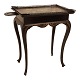 A blackpainted metal tray top table. Denmark late 18th centruy. H: 75cm. Tray: 
44x63cm