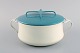 Jens H. Quistgaard: Pot with lid in turquoise and cream colored enamel. Danish 
design, 1960s.

