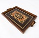 Serving tray of dark wood with inlaid wood, from the 1940s.
5000m2 showroom.