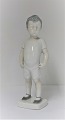 Bing & 
Grøndahl. 
Porcelænsfigur. 
Tidlig model af 
Kaj. Denne er 
hvid. Model 
1617. Højde 
19,5 cm. ...
