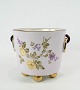 Urtepotteskjuler 
i lyse farver 
dekoreret med 
blomster, i 
flot brugt 
stand fra 
1870erne. 
18 x ...