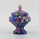 Art deco lidded jar in polychrome mouth-blown art glass on a metal base. Italian 
style, 1930s / 40s.
