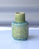Palshus, 
grønlig, 
keramik vase. 
Vasen er søgrøn 
,med 4 felter, 
med ...