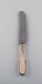 Evald Nielsen 
number 14 
dinner knife in 
hammered silver 
(830) and 
stainless 
steel. 1920s. 
Two ...