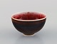 Friedl Holzer Kjellberg (1905-1993) for Arabia. Unique miniature bowl in glazed 
ceramics. Beautiful glaze in red and brown shades. Finnish design, 1960s.
