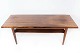 Sofabord i 
palisander med 
hylde, af dansk 
design fra 
1960erne. 
Bordet er i 
flot brugt 
stand. 
H ...
