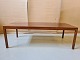 Sofabord i 
fineret 
palisander fra 
1960erne.
H 50cm B 65cm 
L 150cm