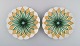 To antikke 
Meissen 
tallerkener i 
håndmalet 
porcelæn. 
Lysegrønne 
blomster og 
gulddekoration. 
...