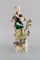 Antik Meissen 
porcelænsfigur. 
Kvinde 
spillende 
fløjte. Sent 
1800-tallet.
Måler: 24,5 x 
12 ...