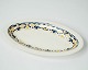 Oval dish decorated with blue and yellow colours from the 1960s. 
5000m2 showroom.