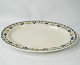 Round dish 
decorated with 
blue and yellow 
colours from 
the 1960s. 
38.5 cm.