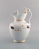 Antique Bing & 
Grøndahl 
chocolate jug 
in porcelain 
modeled with a 
lion on the 
handle. ...