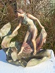 Terracotta. 
Jugend 
figurine.Woman 
with her three 
children .   
Height 43 cm. 
Fine condition.