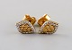 Danish jeweler. A pair of ear studs in 14 carat gold adorned with bright 
diamonds. Late 20th century.
