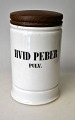 Pharmacies jar 
in white 
porcelain, 19th 
century 
Denmark. With 
lid in wenge. 
With the text: 
White ...