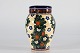 Aluminia 
Fajance
Vase med 
farverig 
blomsterdekoration 
af
Christian 
Joahcim fra 
1909 ...